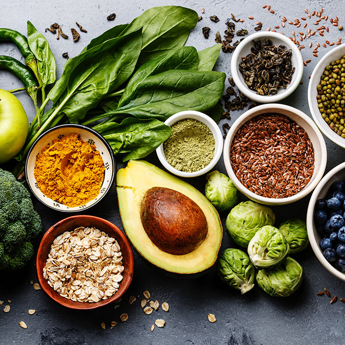 fruits, vegetables, and seeds placed on concrete