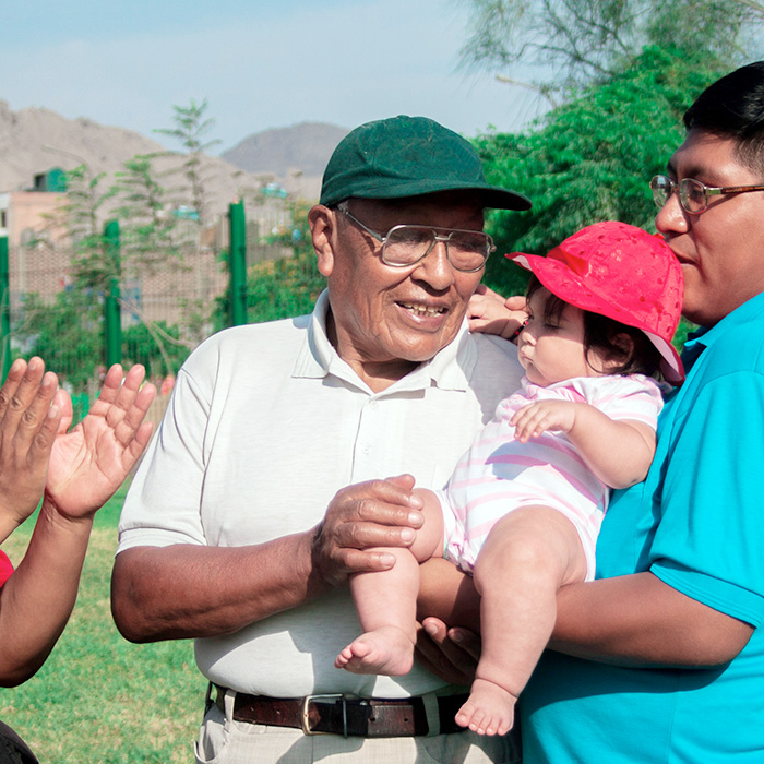 Native american family of three generations having good time in the summer park