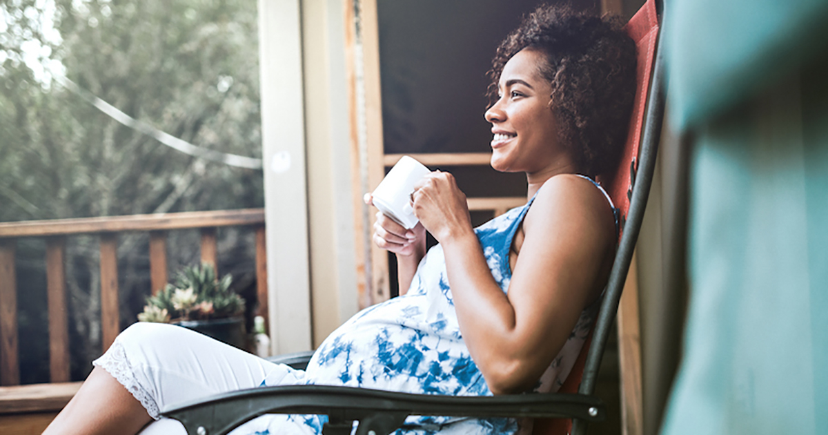 pregnant woman drinking coffee