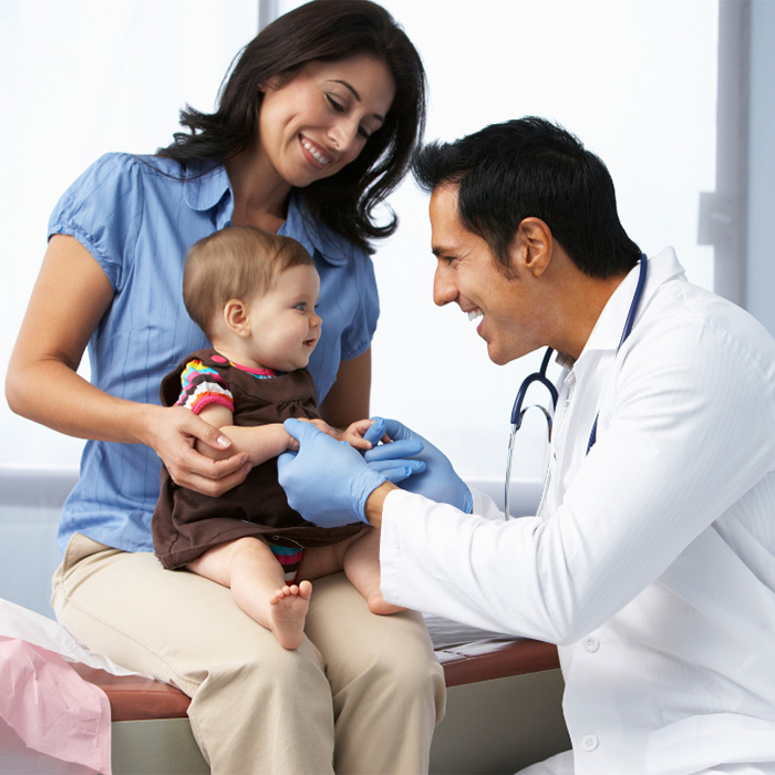 doctor with woman and small child
