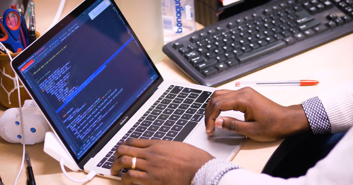 person typing on a laptop