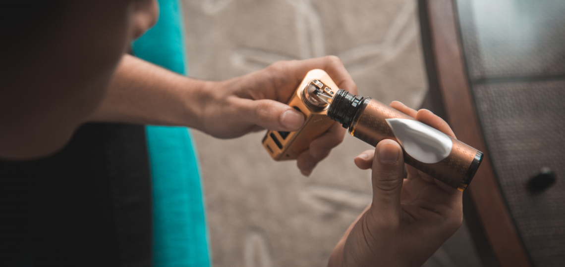 person holding an E-cigarette