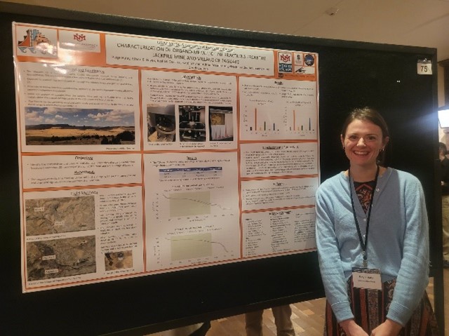 Paige Haley in front of academic poster.