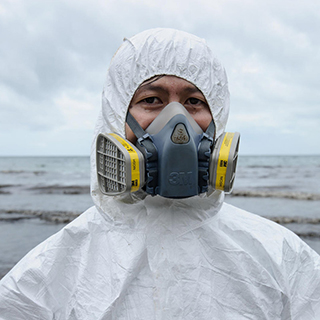 person wearing protective gear and respirator