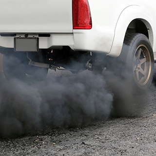 black smoke coming from vehicle exhaust pipe