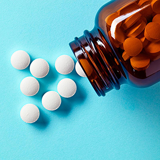 white pills and a pill bottle