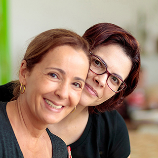 two women posing for photo