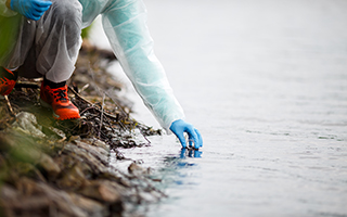 filling a test tube from outdoor water source