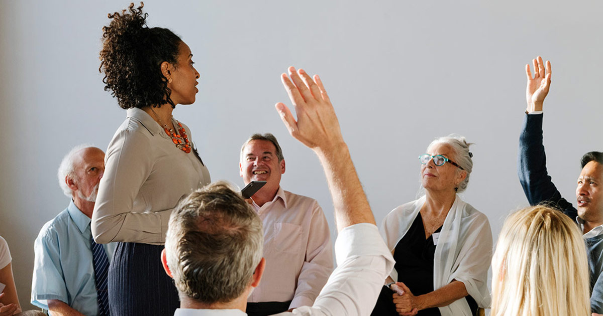 Group of adult professionals in a circle discussion