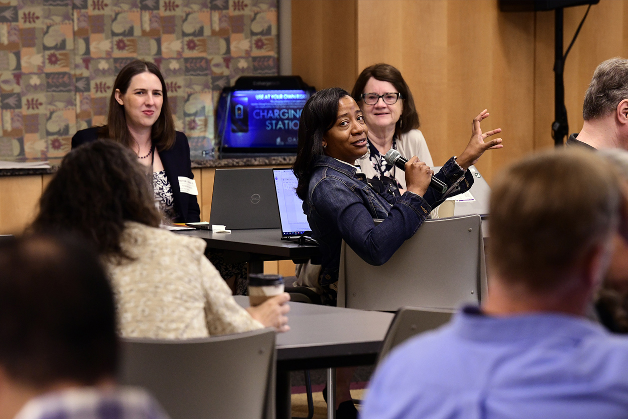 Aisha Dickerson speaking at a meeting