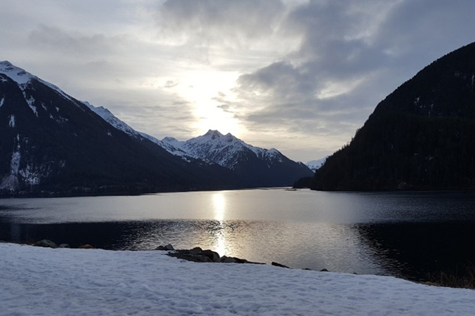 snow-covered mountains and lake in Alaska