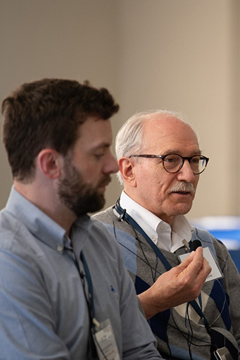 Rick Woychik speaking into a microphone