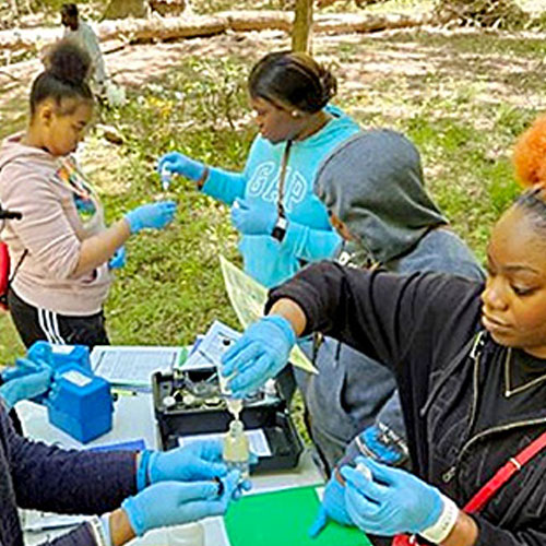high school kids performing field tests