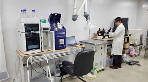 A chemist working with GlycoSurf lab equipment