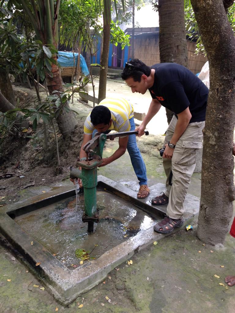 Cardenas collecting water samples from a tube well in Bangladesh