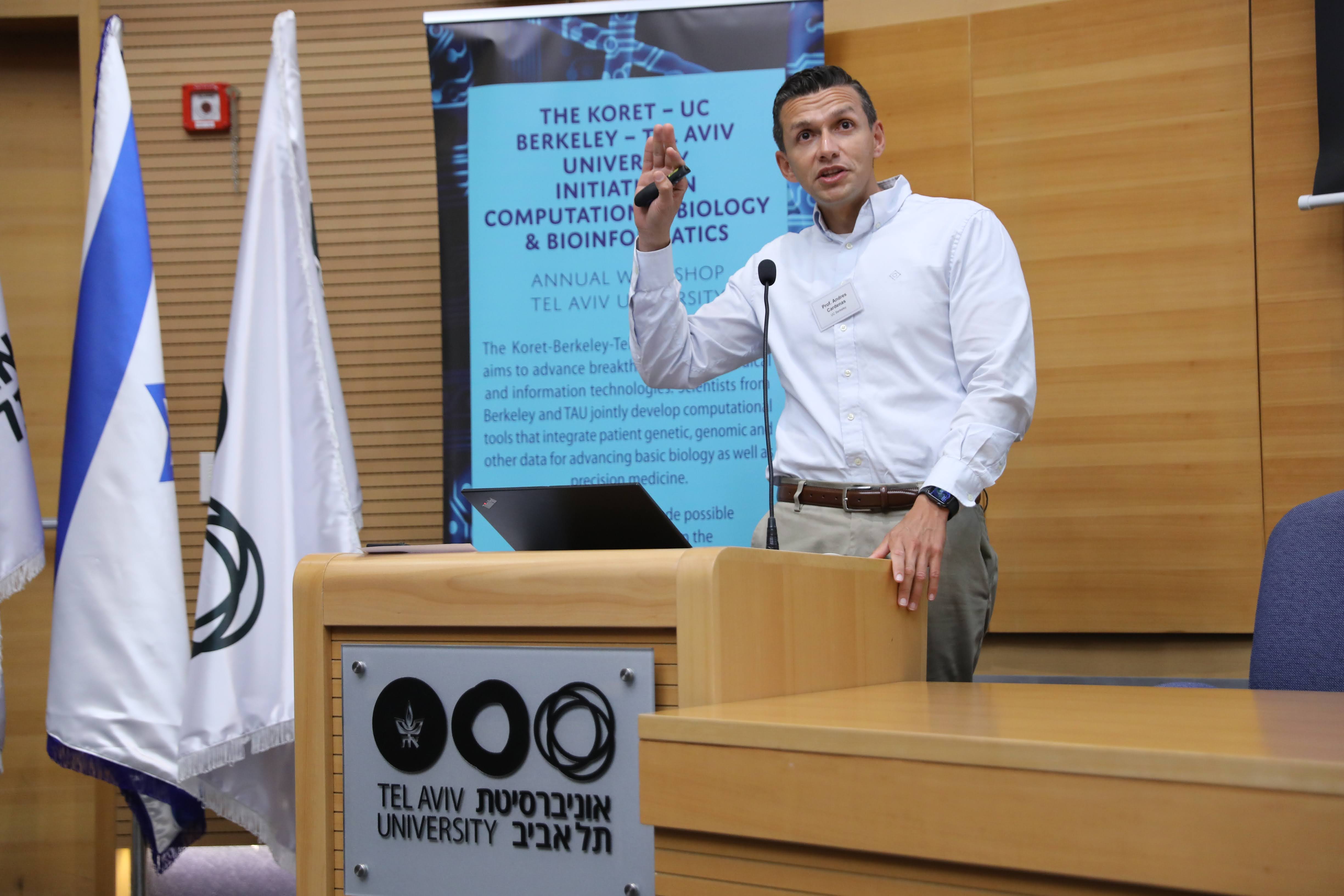 Andres Cardenas speaking at a podium