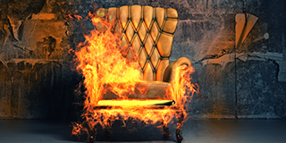 wingback chair covered in flames