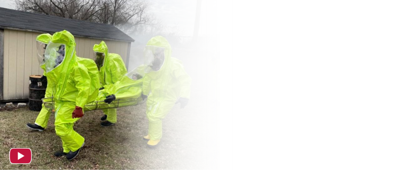 People training in HAZMAT suits with the YouTube logo in the bottom left corner of the photo