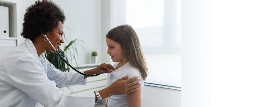 doctor and child in their office
