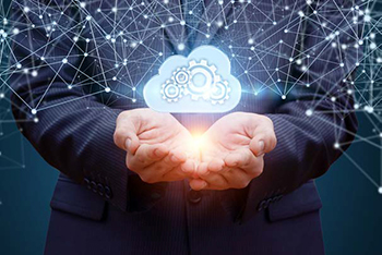 cupped hands with image of cloud with connected nodes