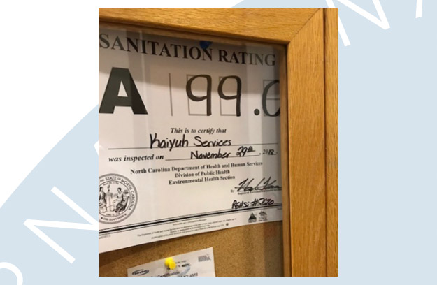 Picture of the public display of the sanitation rating with a score of 99.0