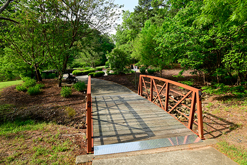 A bridge connected to a walking trail