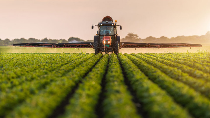 Pesticides being spread by a machine