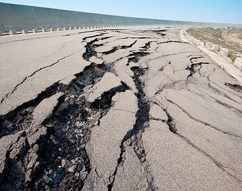 deep cracks in a road caused by earthquake