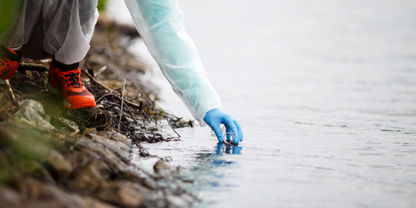 filling a test tube from an outdoor water source