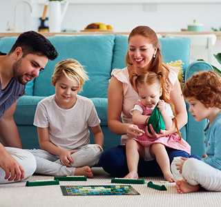 Happy family playing board games