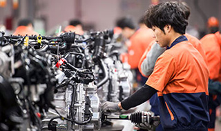 man working in auto factory