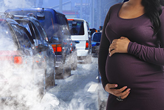 Cars releasing smoke and a pregnant woman standing