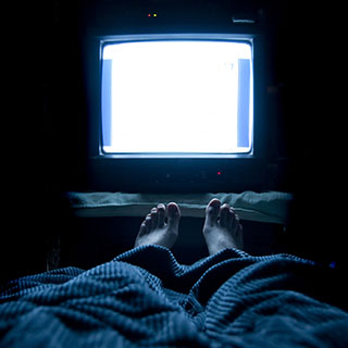 screen lit in dark room