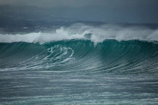 Large waves rolling into the shore