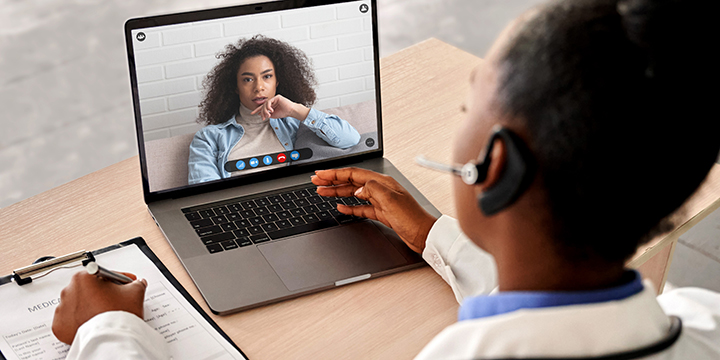 doctor has a virtual meeting with a woman