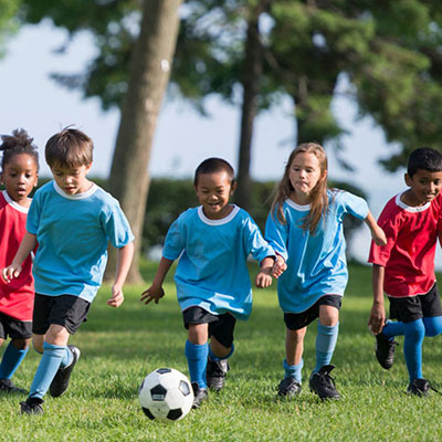 children playing soccer