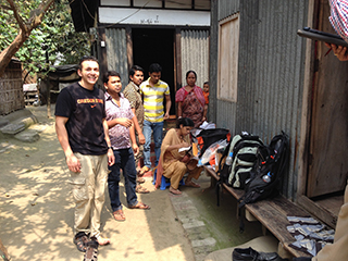 Andres Cardenas, Ph.D. with group of people in Bangladesh
