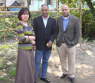 Yu Chen, Ph.D., standing with two colleagues