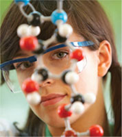 woman looking at chemical structure