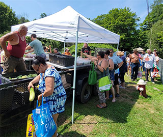 One of four free farmers markets hosted by Chief Vincent Mann (pictured standing in the cart) for the Ramapough Lunaape Tribal Nation