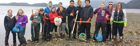 Picture showing interns and SEATOR staff by the water