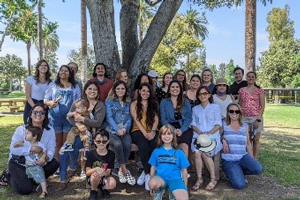 group posing by a tree