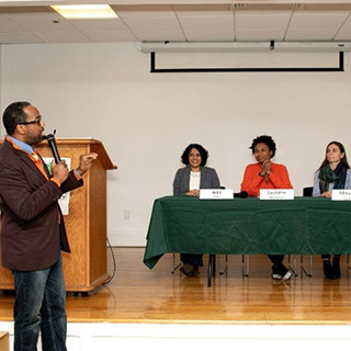 Cecil Corbin-Mark moderates a panel discussion