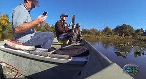 Men in boat on river