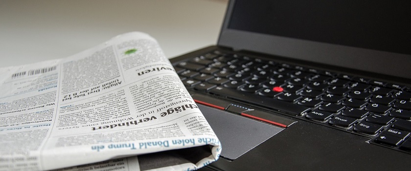Newspaper and laptop