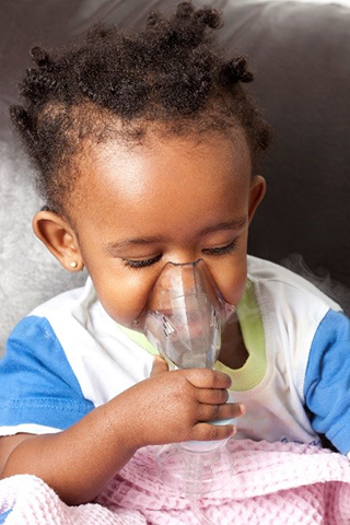 toddler with breathing mask