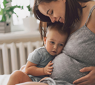 pregnant woman and a small child