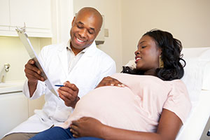 Image of pregnant woman with a doctor