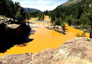 the yellow river flowing through mountain ranges and green forest