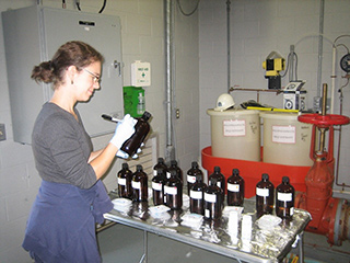 Laurel Schaider labeling bottles